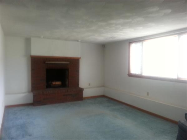 5 Landers Road Stoneham, MA 02180 - Photo 8 of 18 an empty room with a fireplace
