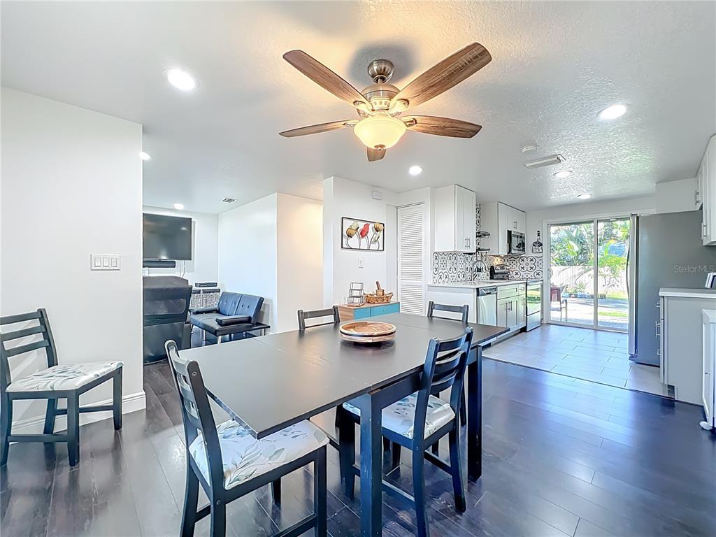 4760 Ivan Street Cocoa, FL 32927 - Photo 12 of 53 a view of a dining room with furniture and wooden floor