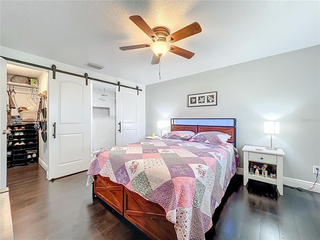 4760 Ivan Street Cocoa, FL 32927 - Photo 21 of 53 a bedroom with a bed and a ceiling fan