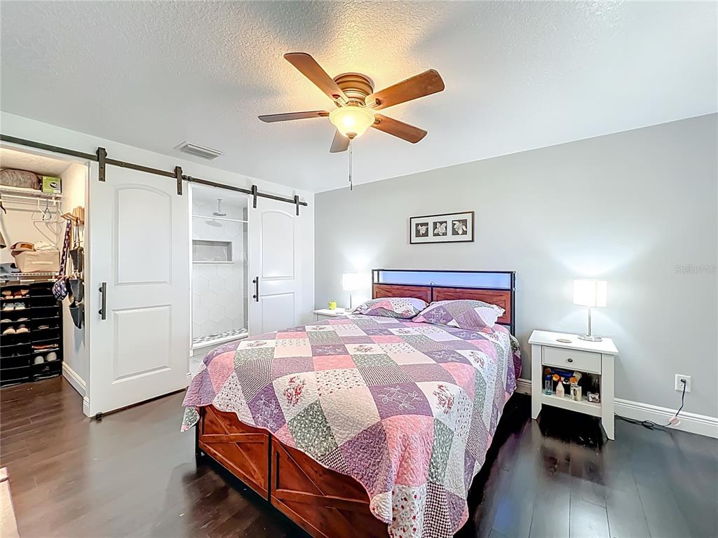 4760 Ivan Street Cocoa, FL 32927 - Photo 23 of 53 a bedroom with a bed and a ceiling fan