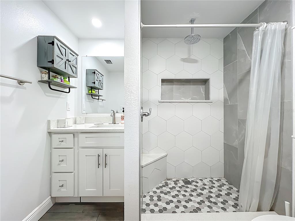 4760 Ivan Street Cocoa, FL 32927 - Photo 26 of 53 a bathroom with a sink and a mirror