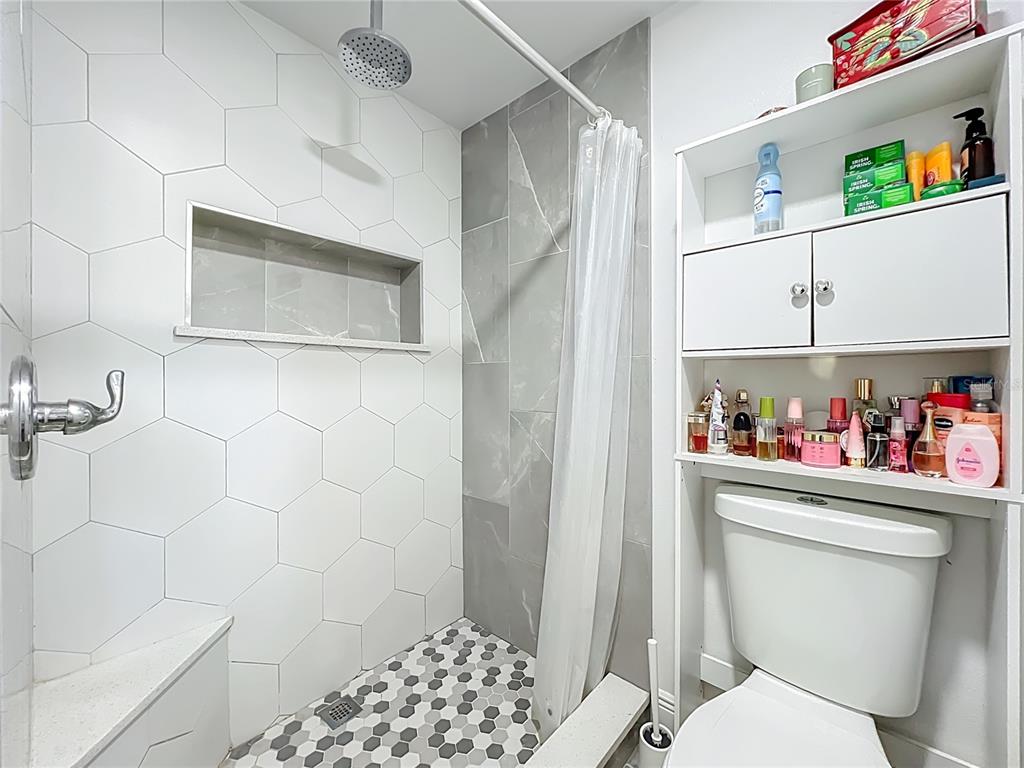 4760 Ivan Street Cocoa, FL 32927 - Photo 29 of 53 a bathroom with a toilet and a shower