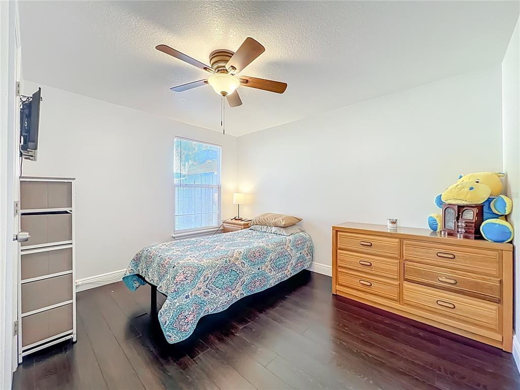 4760 Ivan Street Cocoa, FL 32927 - Photo 31 of 53 a bedroom with a bed and a chandelier