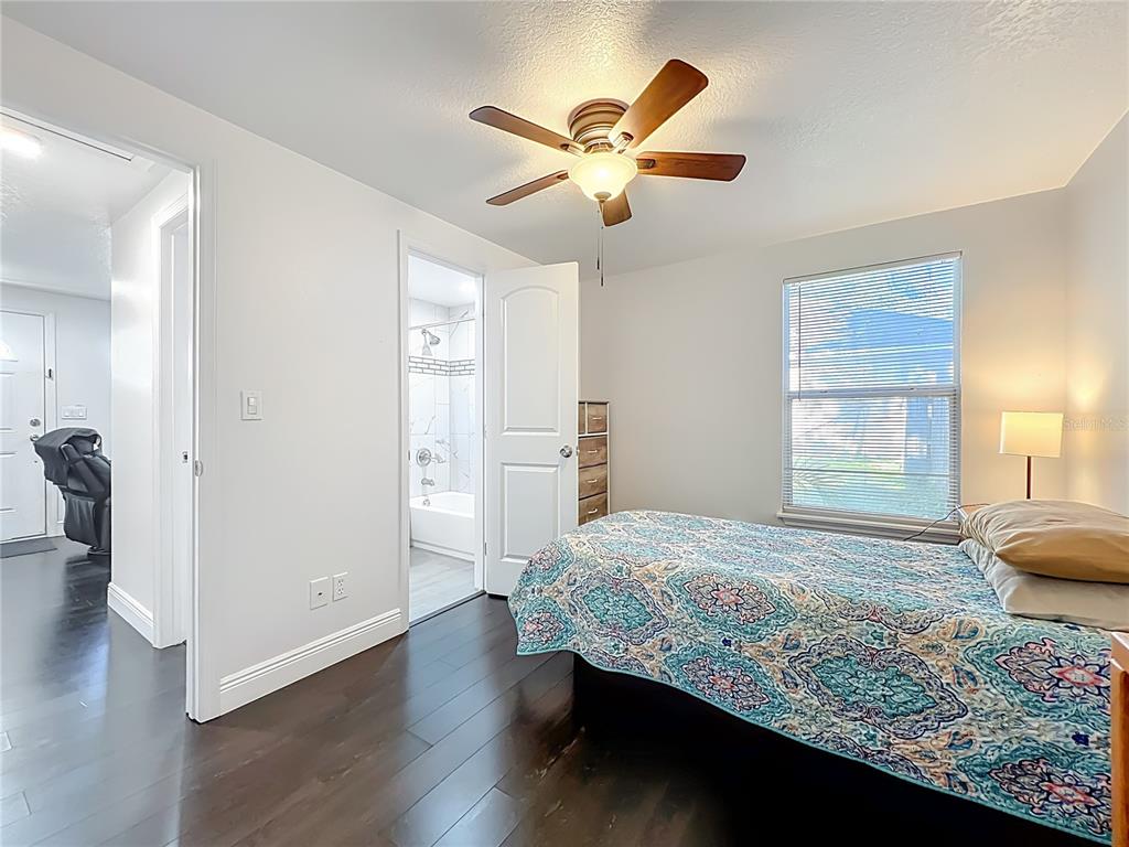 4760 Ivan Street Cocoa, FL 32927 - Photo 32 of 53 a bedroom with a bed and a ceiling fan