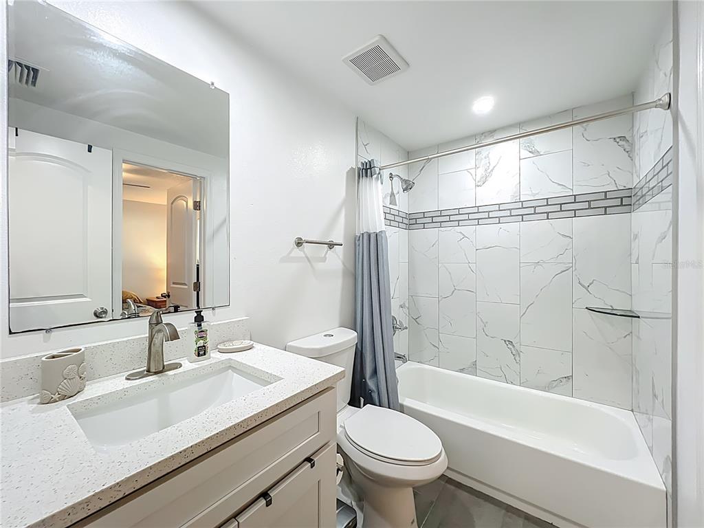 4760 Ivan Street Cocoa, FL 32927 - Photo 35 of 53 a bathroom with a sink toilet and shower