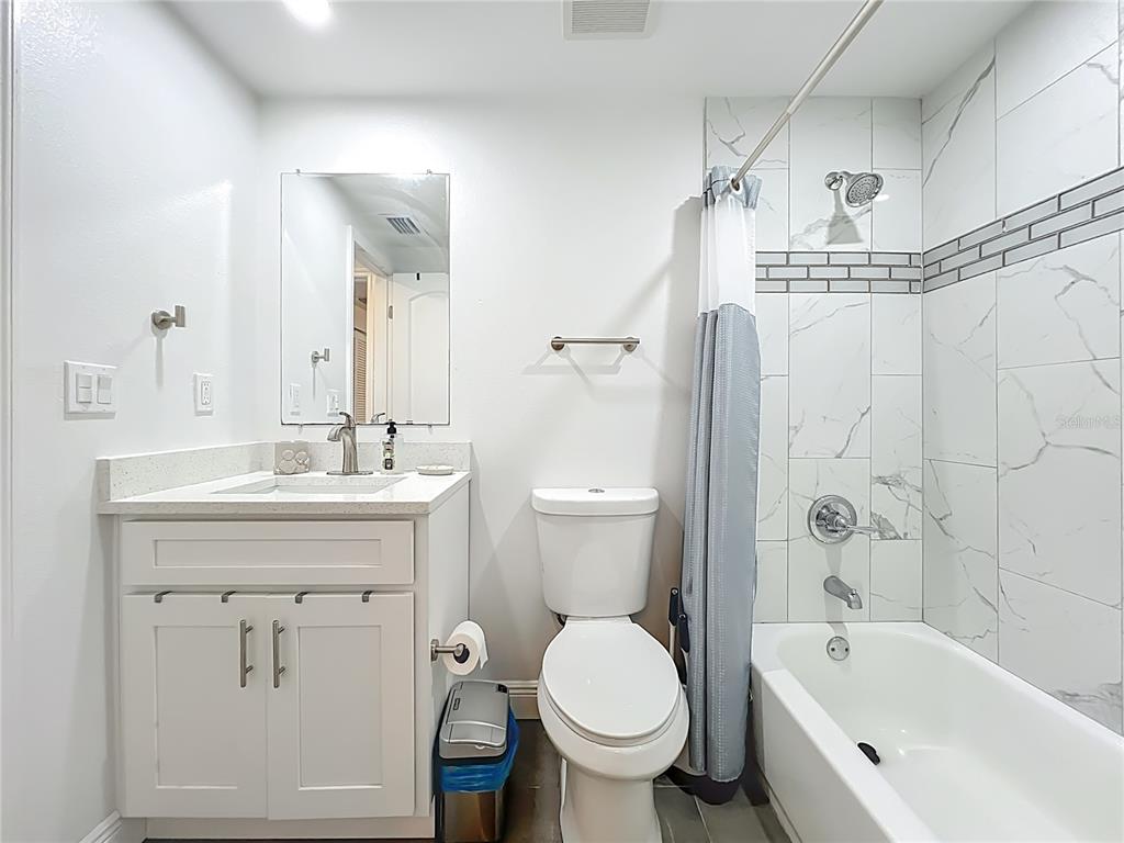 4760 Ivan Street Cocoa, FL 32927 - Photo 37 of 53 a bathroom with a sink a toilet and shower