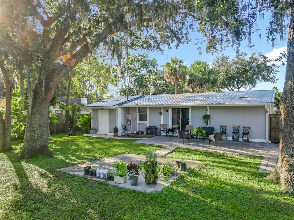 4760 Ivan Street Cocoa, FL 32927 - Photo 44 of 53 a front view of house with yard and outdoor seating