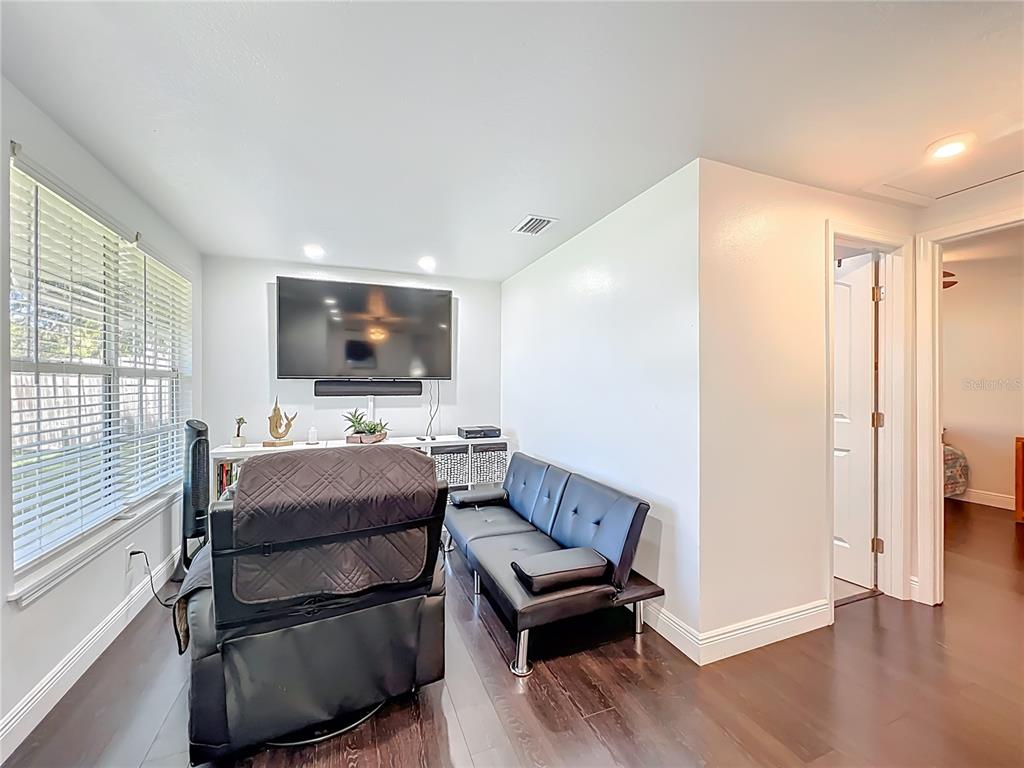 4760 Ivan Street Cocoa, FL 32927 - Photo 8 of 53 a living room with furniture and a flat screen tv