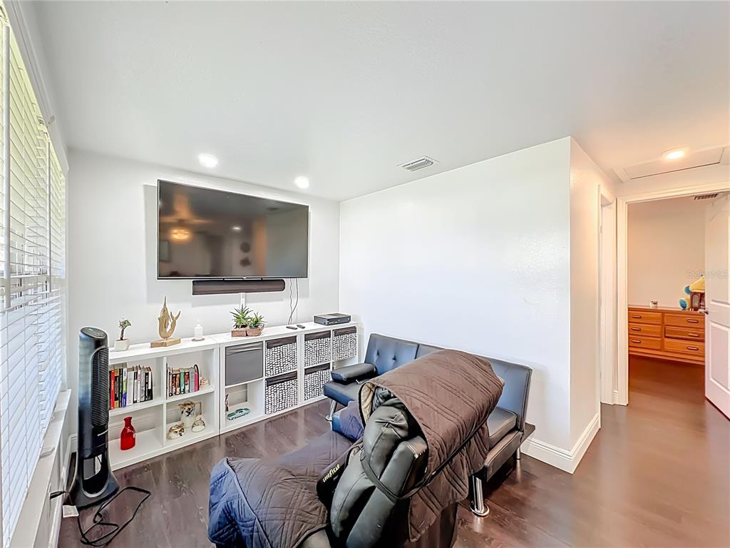 4760 Ivan Street Cocoa, FL 32927 - Photo 9 of 53 a living room with furniture and a flat screen tv