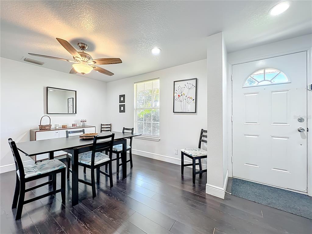 4760 Ivan Street Cocoa, FL 32927 - Photo 10 of 53 a view of a a dining room with furniture window and wooden floor