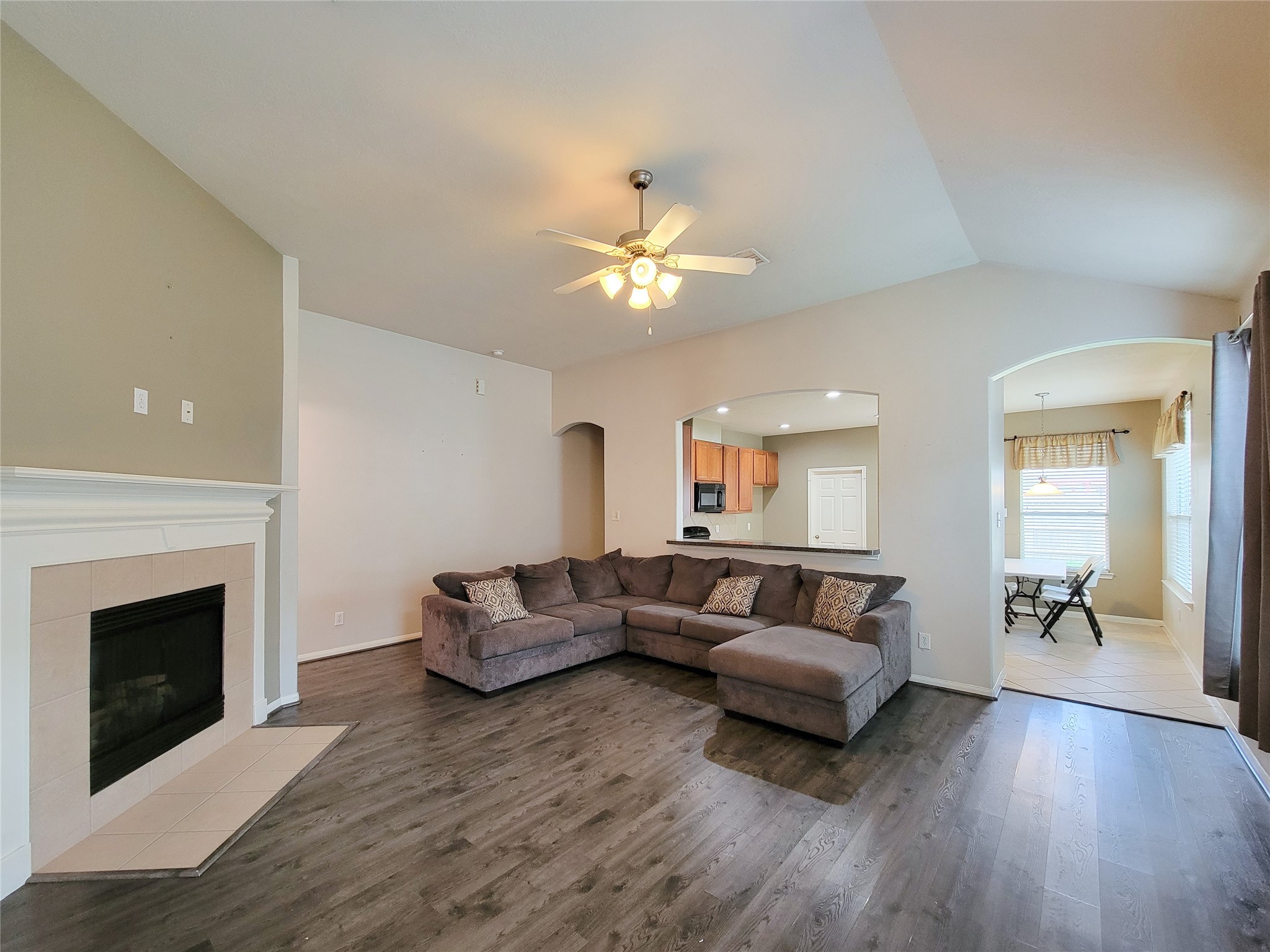 25223 Hazel Ranch Drive Katy, TX 77494 - Photo 5 of 20 a living room with furniture and a fireplace