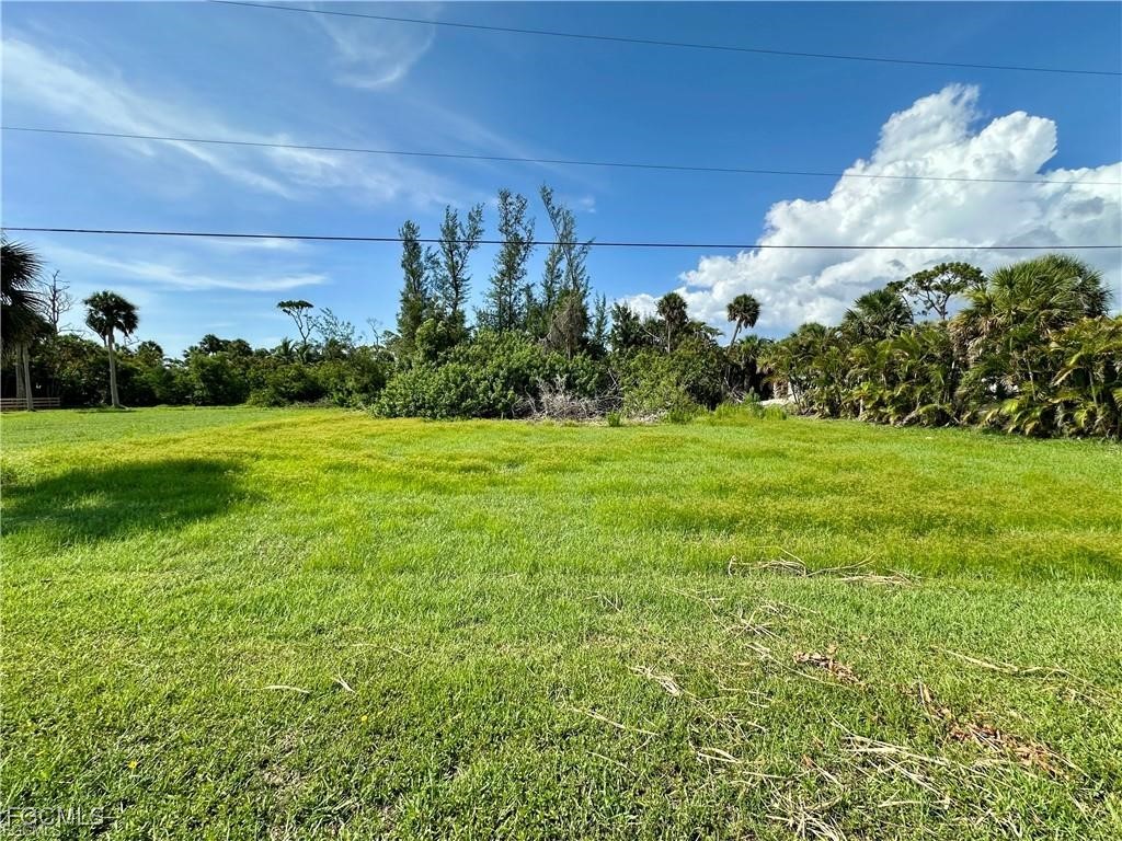 7770 Grande Pine Road Bokeelia, FL 33922 - Photo 2 of 5 a view of a golf course with a house