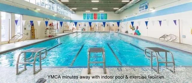a bedroom with a baby bed baby crib and a window