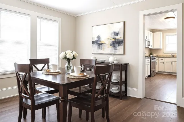 a view of a dining room with furniture and wooden floor