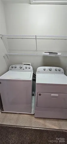 a utility room with washer and dryer
