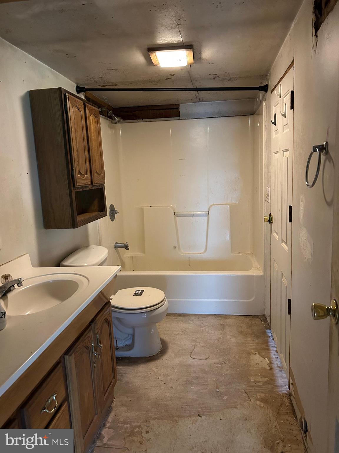 12632 Creagerstown Road Thurmont, MD 21788 - Photo 12 of 16 a bathroom with a sink a toilet and shower