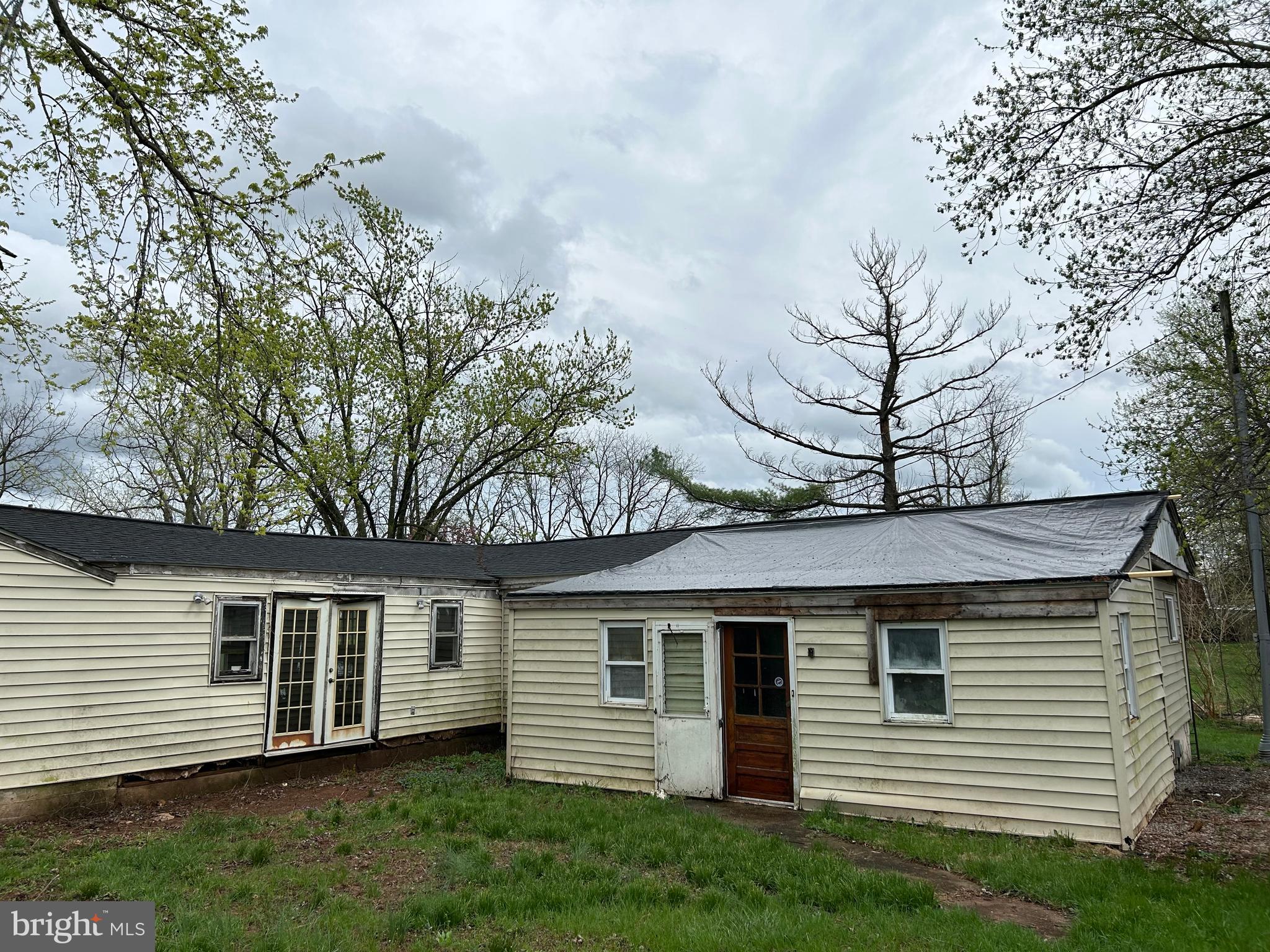 12632 Creagerstown Road Thurmont, MD 21788 - Photo 5 of 16 a front view of a house with a garden