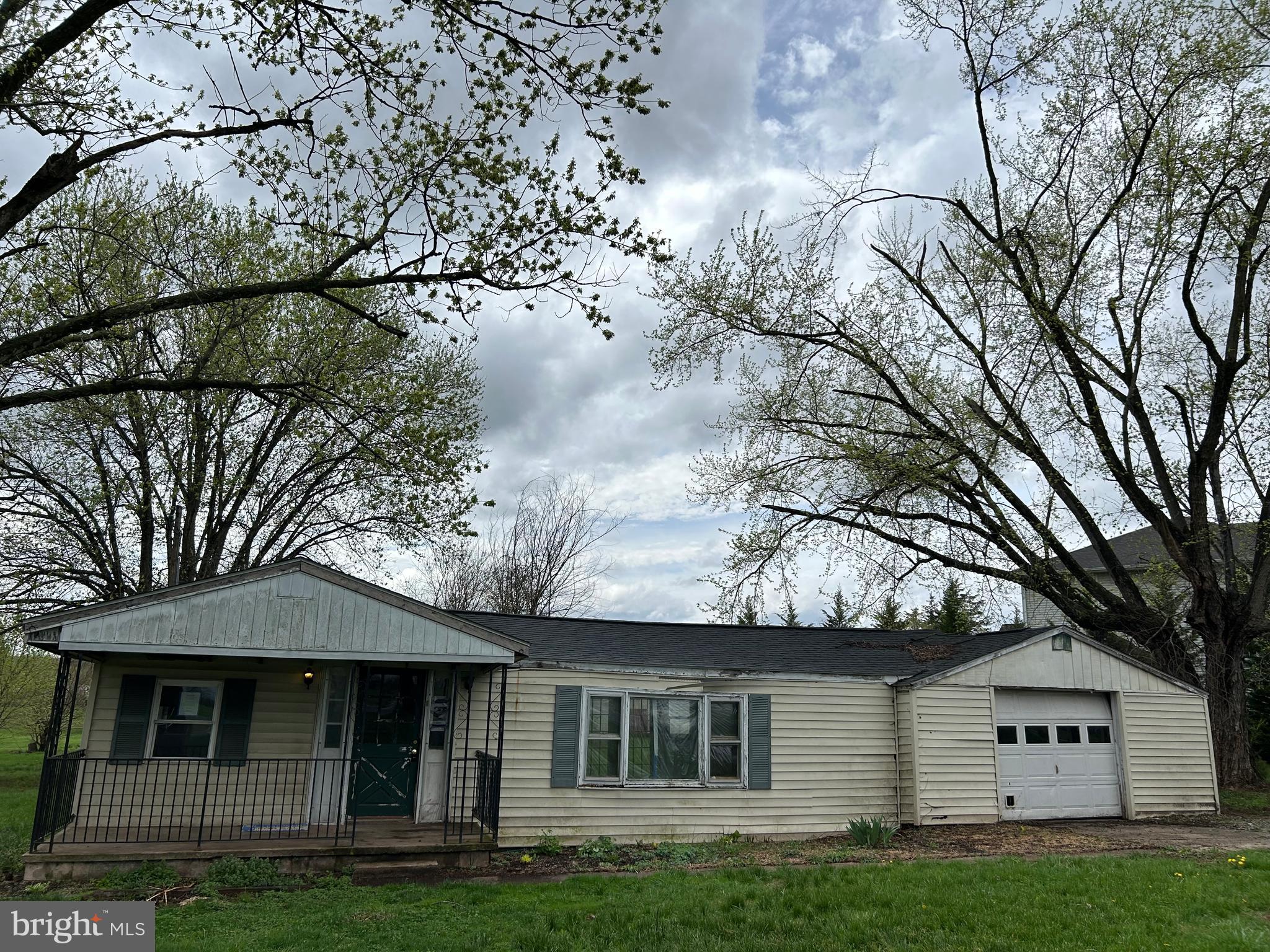 12632 Creagerstown Road Thurmont, MD 21788 - Photo 9 of 16 a front view of a house with garden