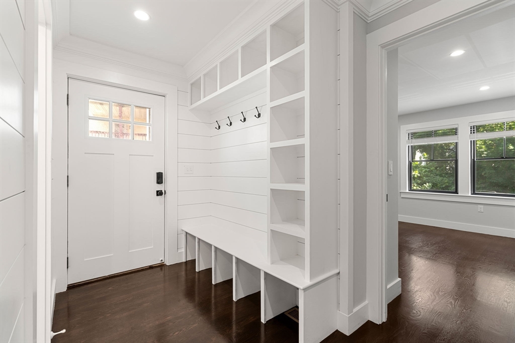4 Crossman Street, Unit 4 Boston, MA 02126 - Photo 14 of 22 wooden floor in an empty room with a window