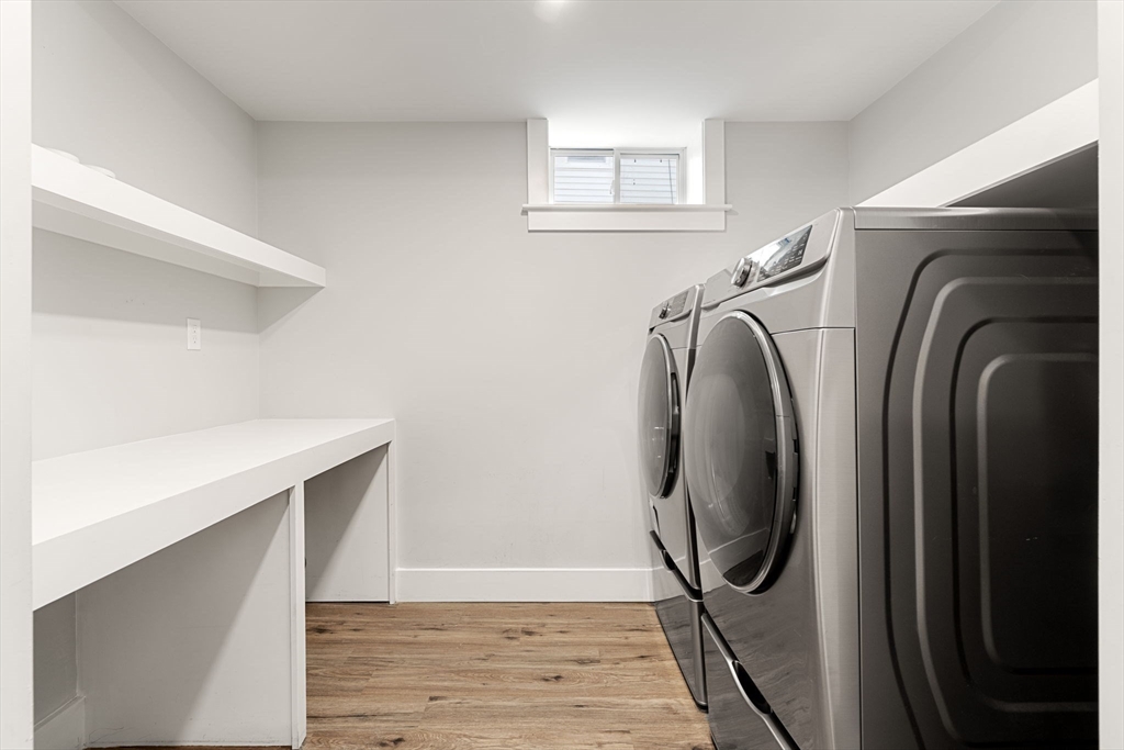4 Crossman Street, Unit 4 Boston, MA 02126 - Photo 17 of 22 a utility room with dryer and washer