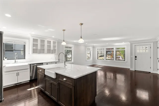 a kitchen with a stove a sink and a refrigerator