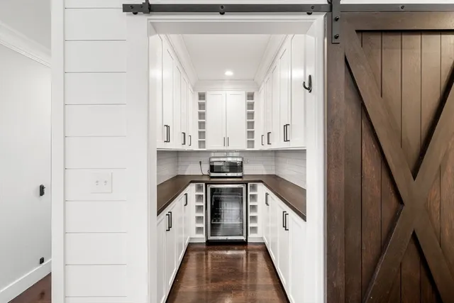 a view of a kitchen with a sink and dishwasher