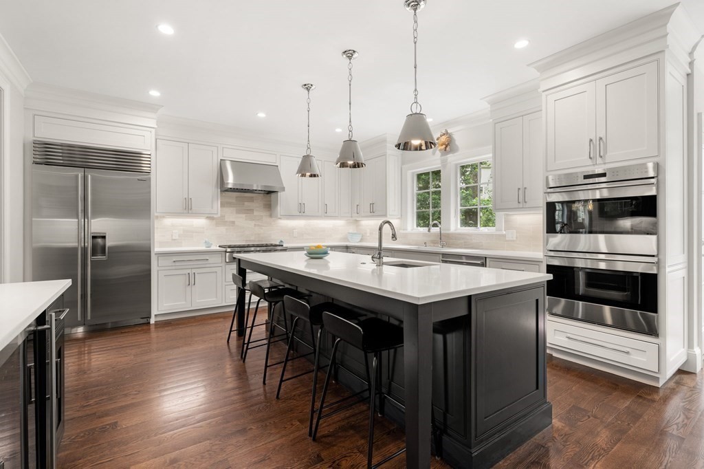 15 Parker Road Needham, MA 02494 - Photo 2 of 41 a kitchen with kitchen island granite countertop a sink and stainless steel appliances