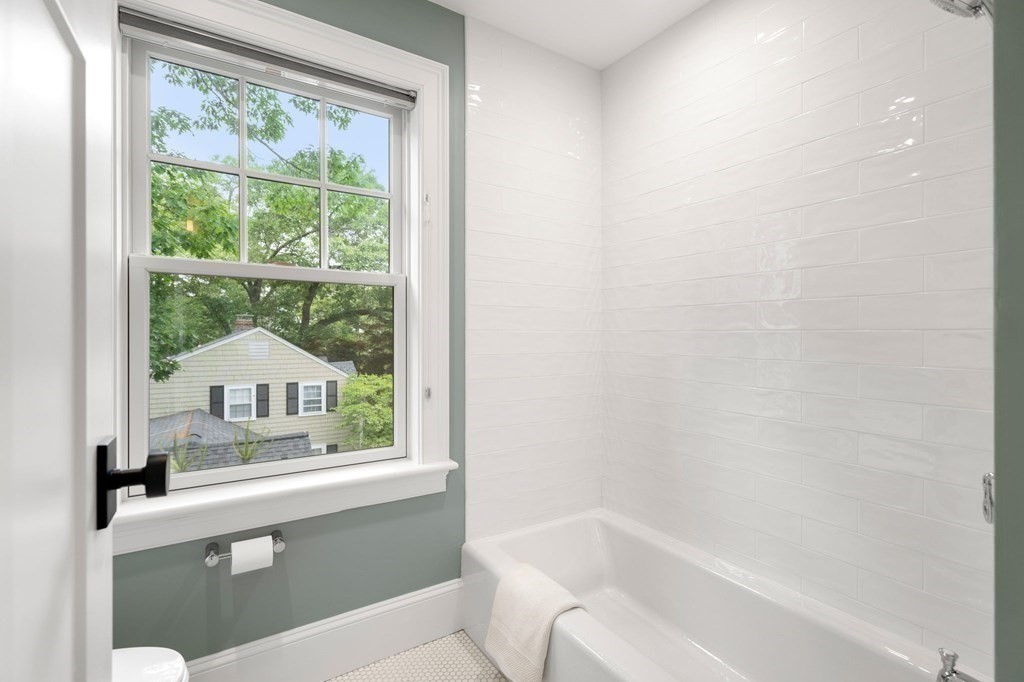 15 Parker Road Needham, MA 02494 - Photo 23 of 41 a bathroom with a sink and a bathtub