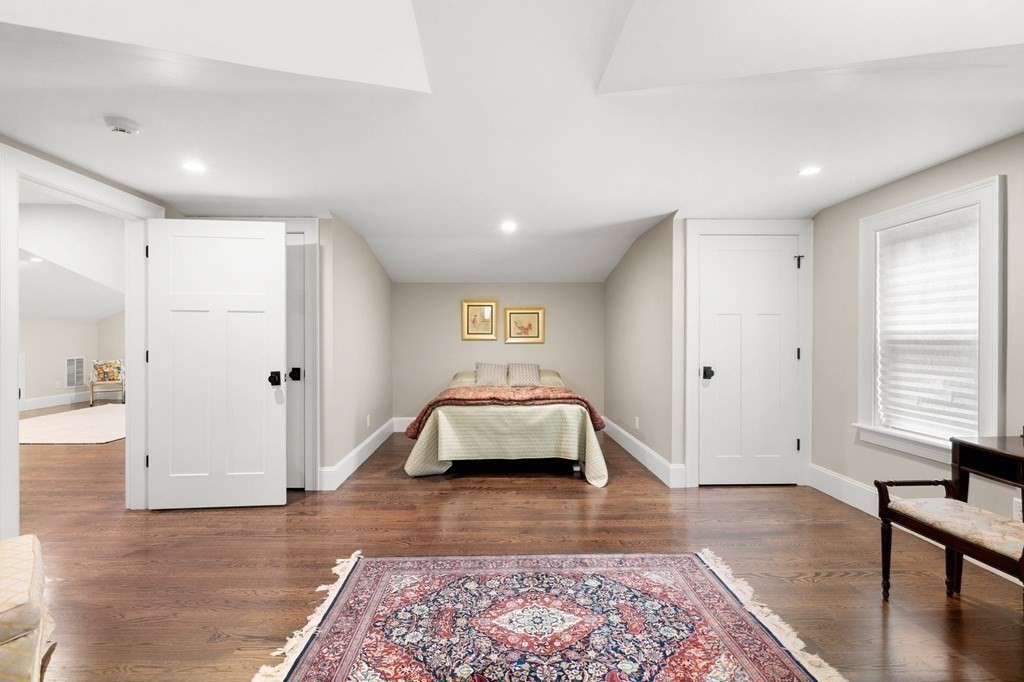 15 Parker Road Needham, MA 02494 - Photo 26 of 41 a bedroom with a bed and wooden floor