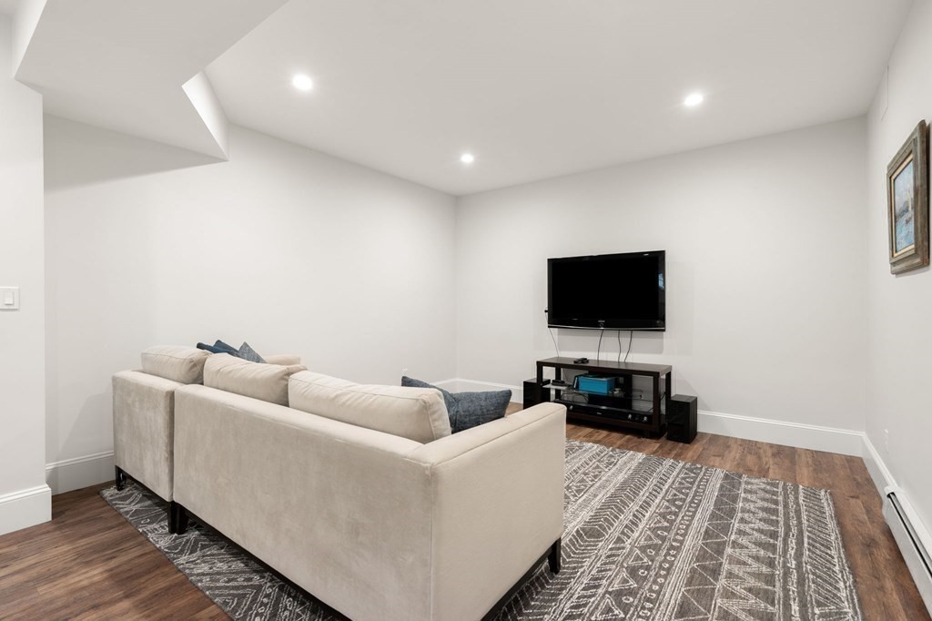15 Parker Road Needham, MA 02494 - Photo 30 of 41 a living room with furniture and a flat screen tv