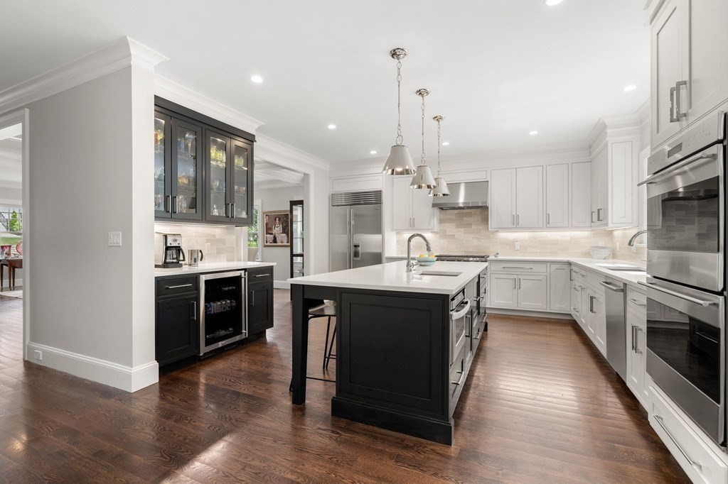 15 Parker Road Needham, MA 02494 - Photo 3 of 41 a kitchen with stainless steel appliances granite countertop a sink stove and refrigerator