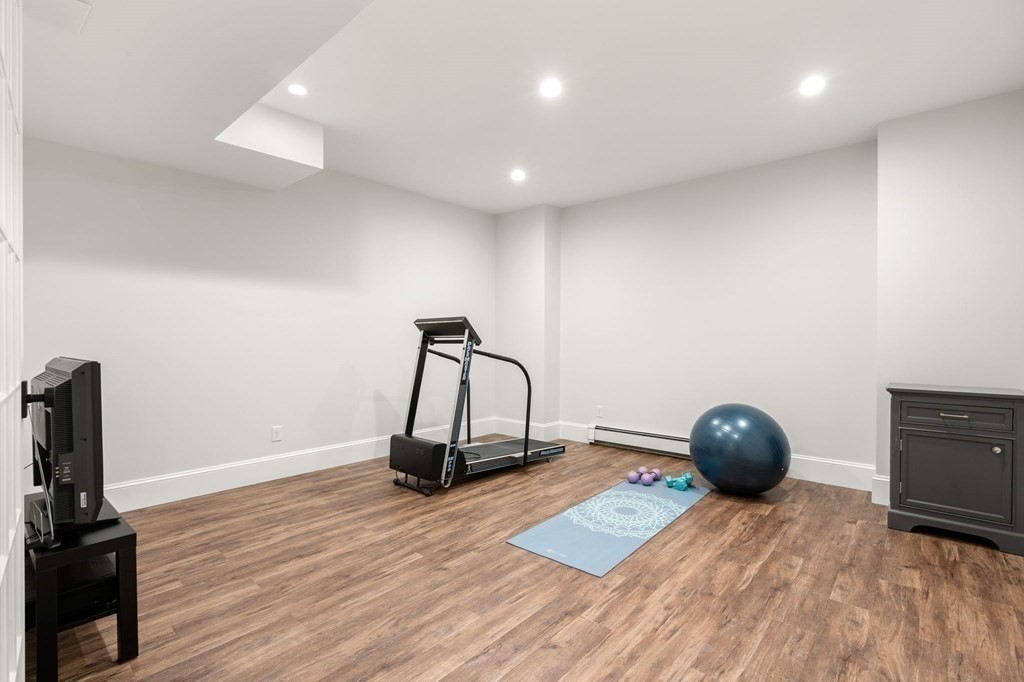 15 Parker Road Needham, MA 02494 - Photo 33 of 41 a room with a wooden floor and gym equipment