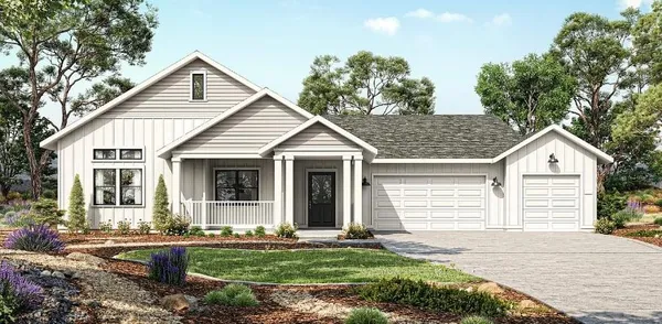 a view of a house with yard and plants