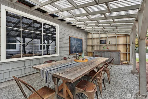 a table and chairs in front of a house