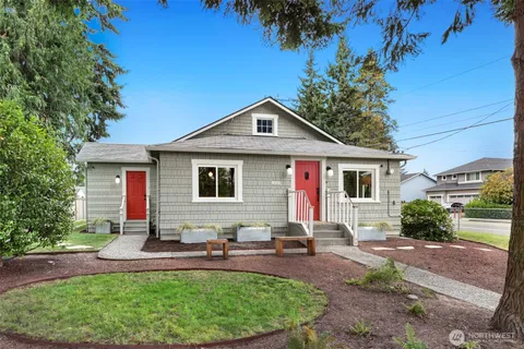 a front view of house with yard and outdoor seating
