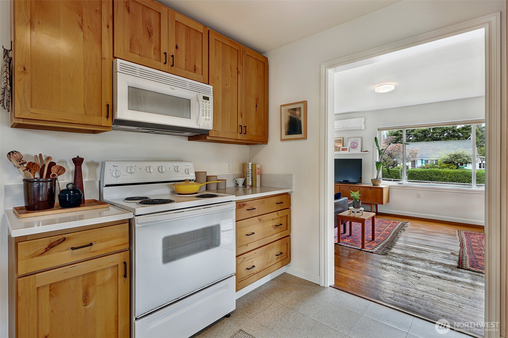 16003 15th Avenue Southwest Burien, WA 98166 - Photo 25 of 36 a kitchen with stainless steel appliances granite countertop a stove a sink and a microwave