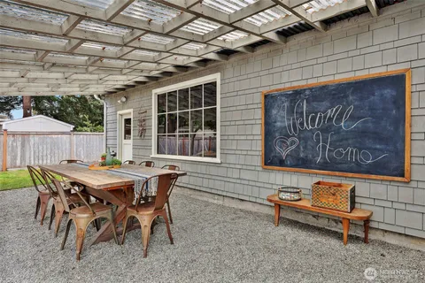 a dinning table and chairs in a patio
