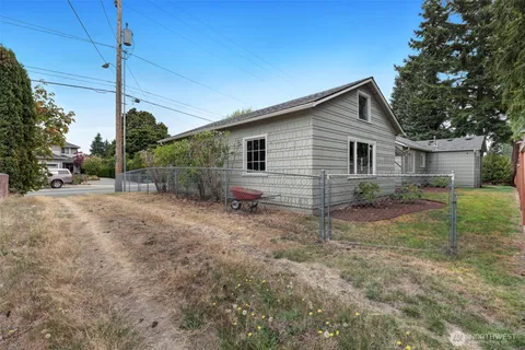 a view of a house with yard and a garden