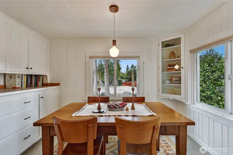 a dining room with furniture window wooden floor