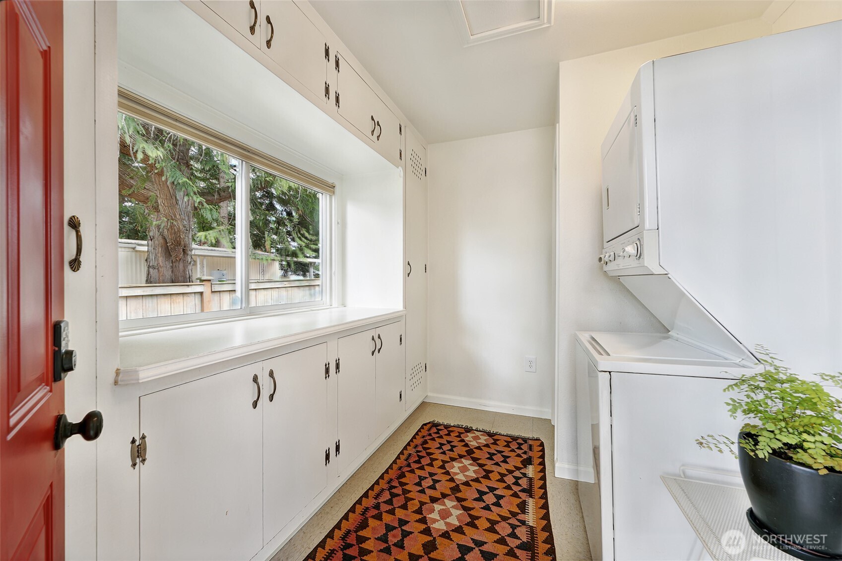 16003 15th Avenue Southwest Burien, WA 98166 - Photo 10 of 36 a kitchen with granite countertop a sink and a window