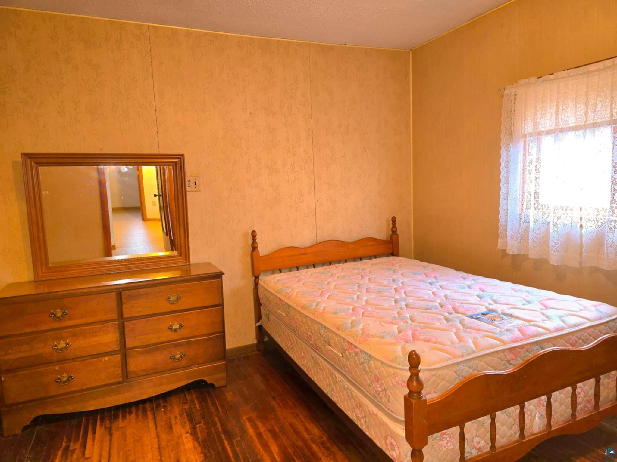 66282 County Rd C Marengo, WI 54855 - Photo 12 of 31 Bedroom featuring dark hardwood / wood-style floors