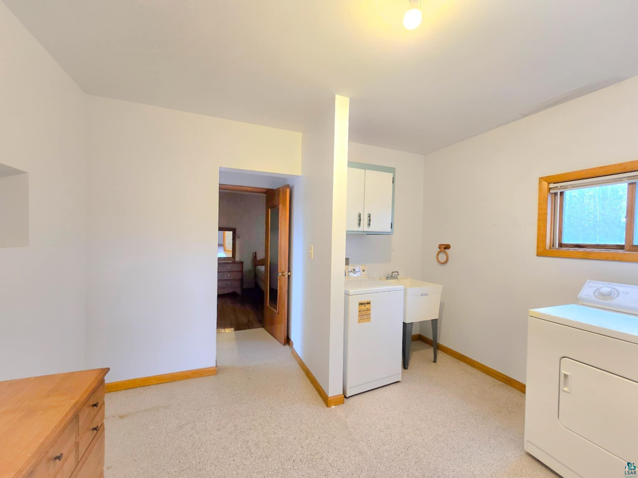 66282 County Rd C Marengo, WI 54855 - Photo 16 of 31 Laundry room featuring cabinets and washer / clothes dryer