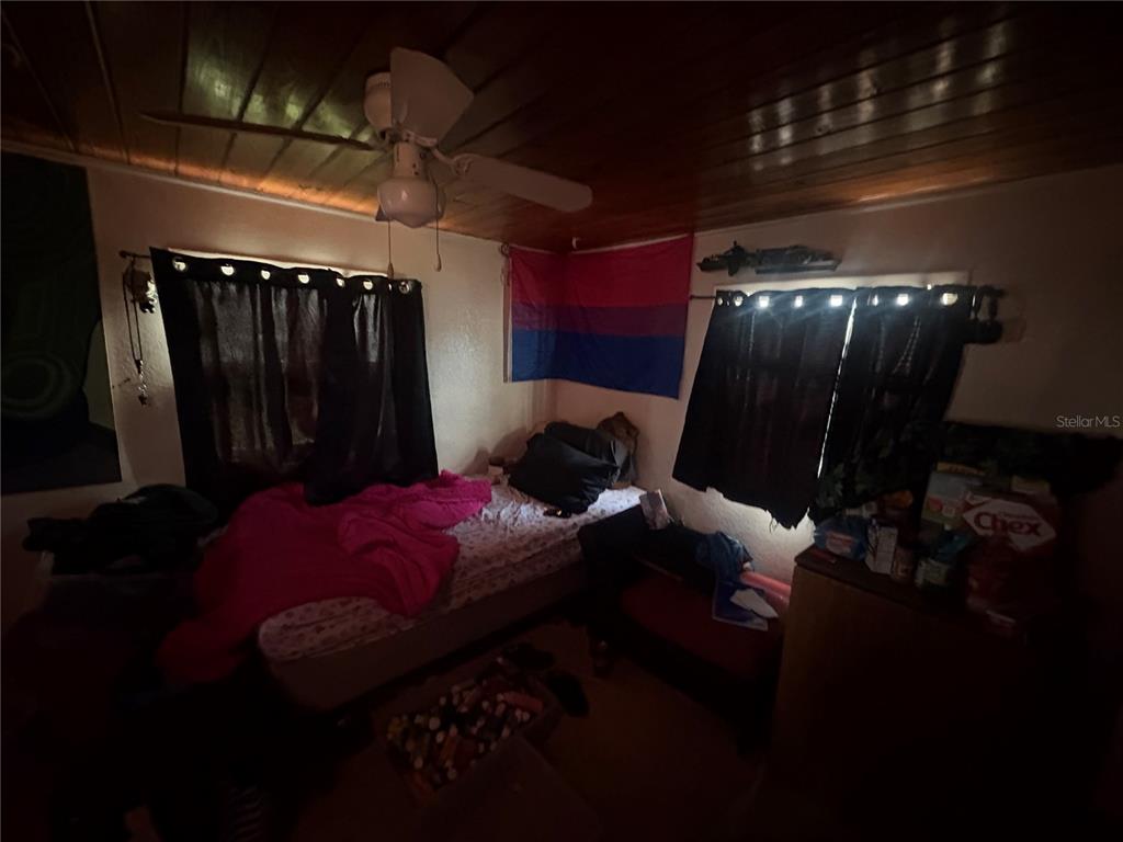 2330 Azalea Court Lakeland, FL 33815 - Photo 14 of 37 a bed sitting in a room next to a window