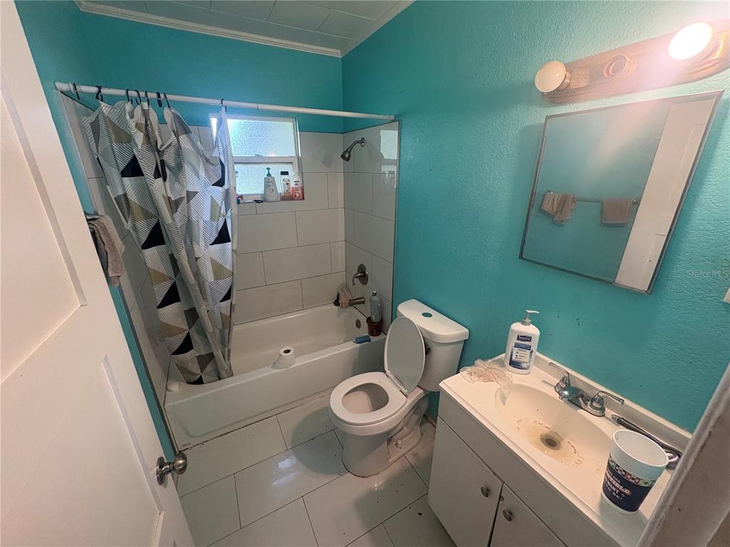 2330 Azalea Court Lakeland, FL 33815 - Photo 18 of 37 a bathroom with a sink toilet and shower