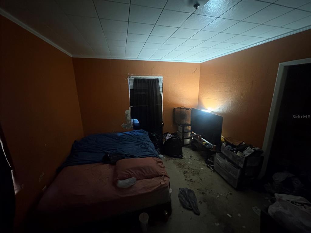 2330 Azalea Court Lakeland, FL 33815 - Photo 21 of 37 a bedroom with a bed and a mirror