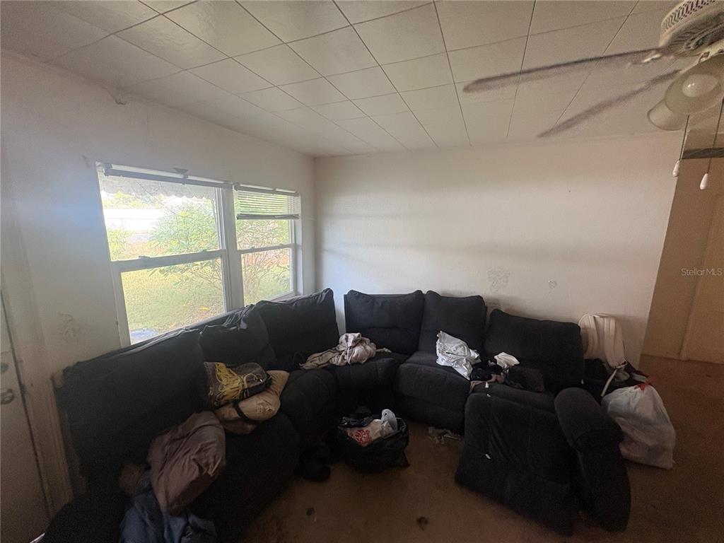 2330 Azalea Court Lakeland, FL 33815 - Photo 6 of 37 a living room with furniture and a window