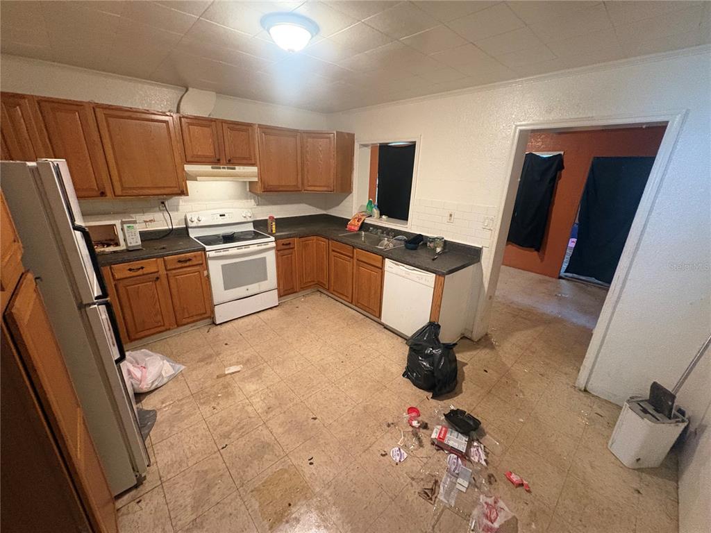 2330 Azalea Court Lakeland, FL 33815 - Photo 7 of 37 a kitchen with a sink appliances and cabinets