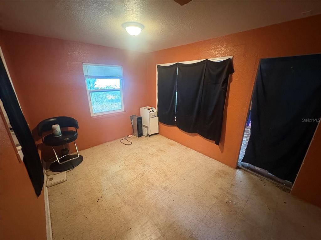 2330 Azalea Court Lakeland, FL 33815 - Photo 9 of 37 a bedroom with a bed and cabinets