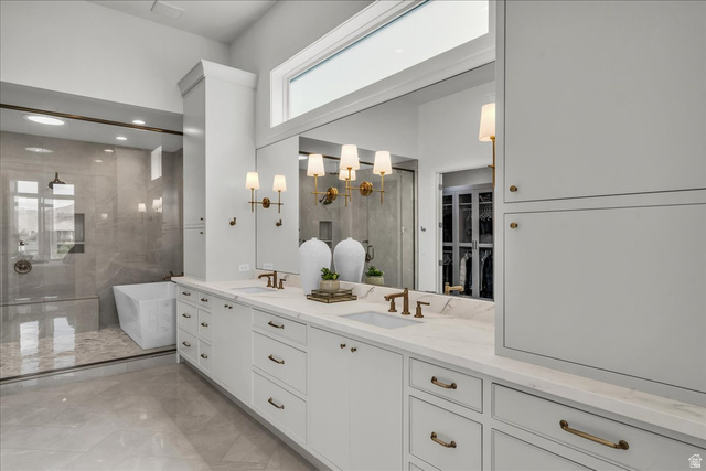2608 Canyon Ridge Drive St. George, UT 84770 - Photo 34 of 86 Expansive primary bathroom featuring a double vanity with white cabinetry and light-toned countertops