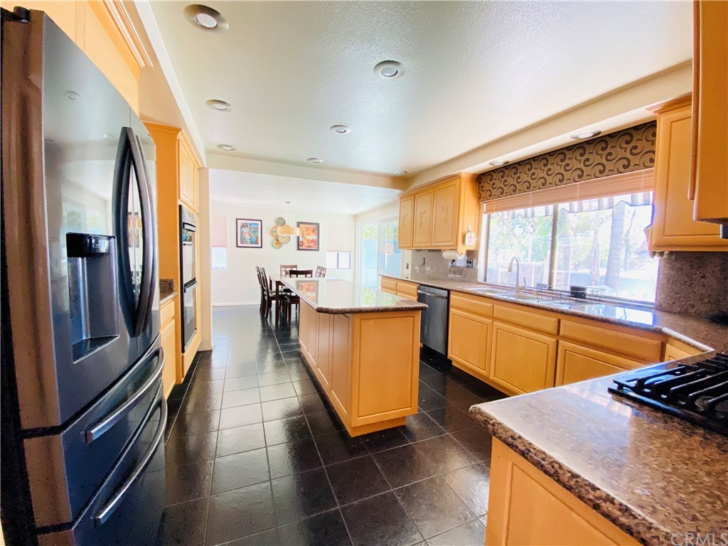 21901 Chaster Road Lake Forest, CA 92630 - Photo 9 of 33 Kitchen with granite counters and gas cooktop
